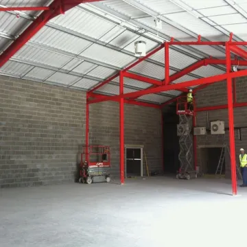 Warehouse construction with red steel frame
