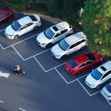Overhead view of car park with painted bays