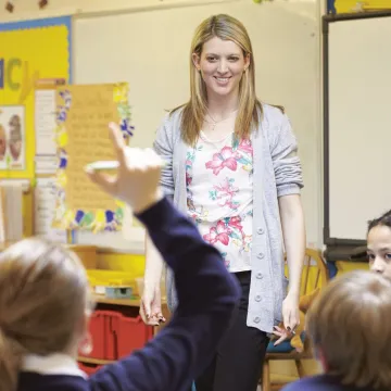 A teacher in the classroom with young children