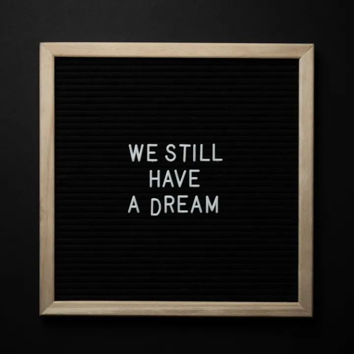 A black letterboard featuring the phrase 'We