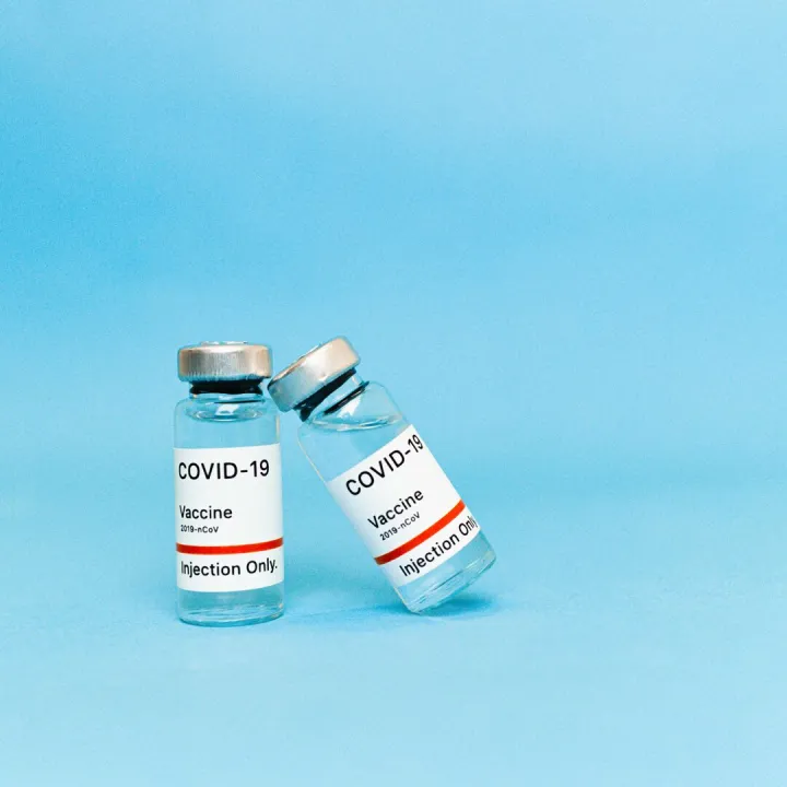 Two COVID-19 vaccine vials labeled for injection