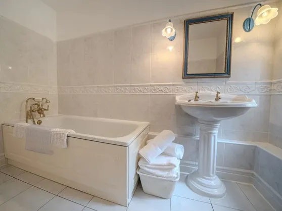 The family bathroom with bath and shower