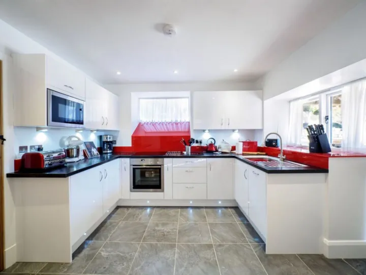 The modern open plan kitchen at Otters Retreat with built in appliances