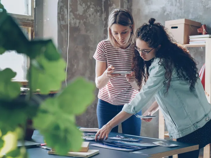 Two designers working together at a table in a