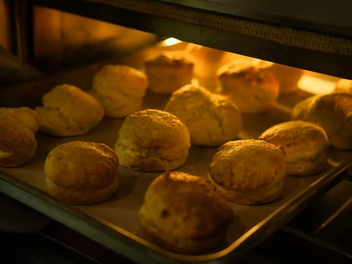 Close-up of freshly baked biscuits turning golden