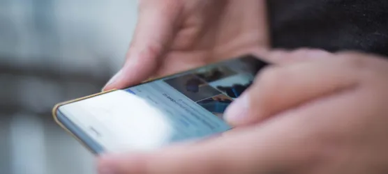 Person Using Smartphone Shallow Focus Photography