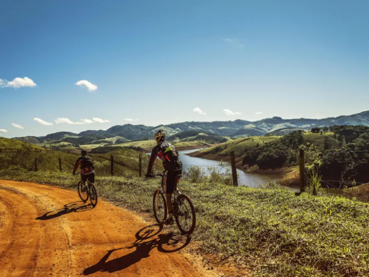 Bicyclist Passing the Road Near the River