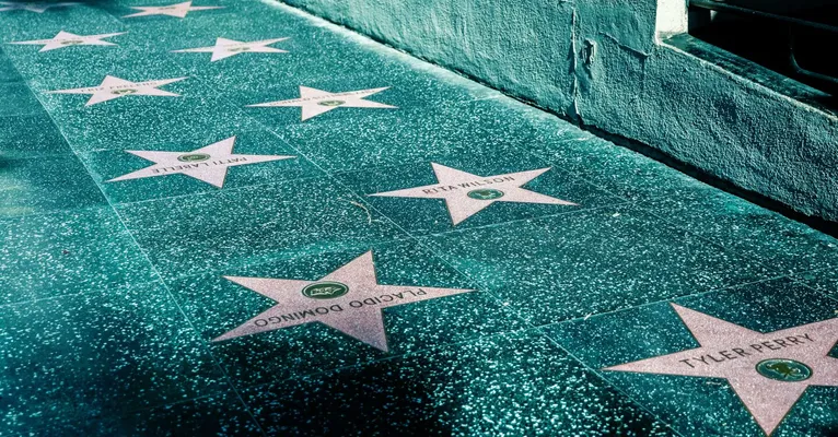 View of Hollywood Walk of Fame with stars on the sidewalk in Los Angeles, California.