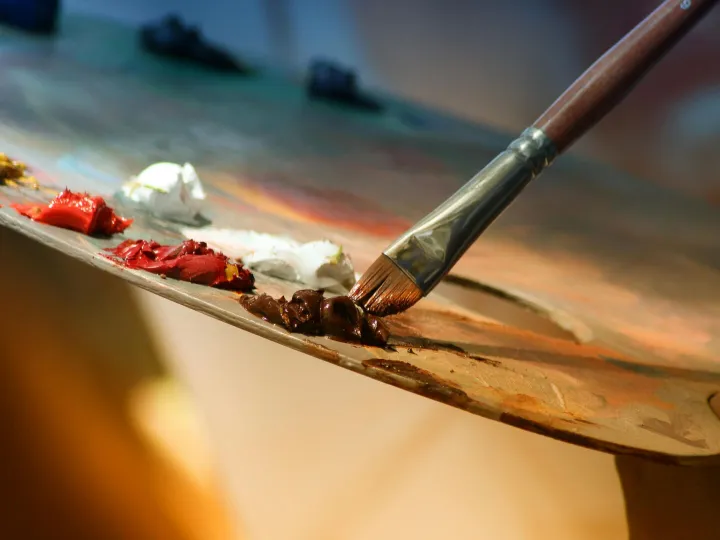 Vibrant artist palette with paint and brush