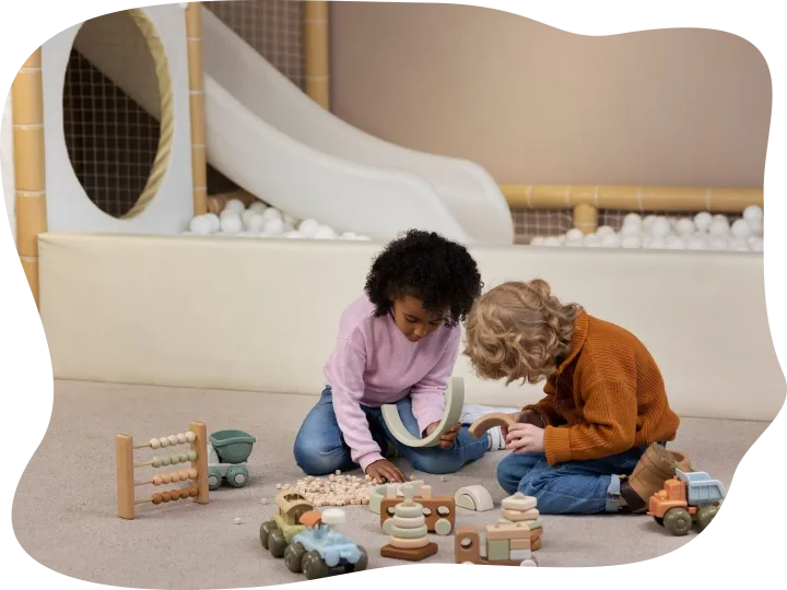 Full shot kids playing with eco toys indoors