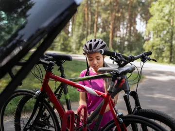 Front view woman holding bicycle