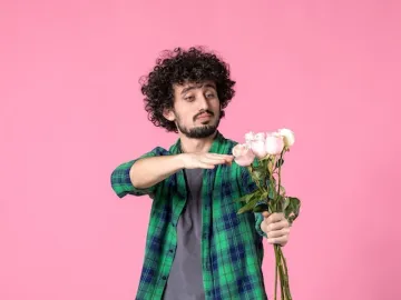 Front view young male with pink roses on pink