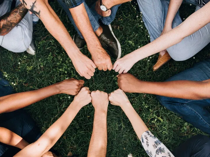 Diverse community with hands in a circle