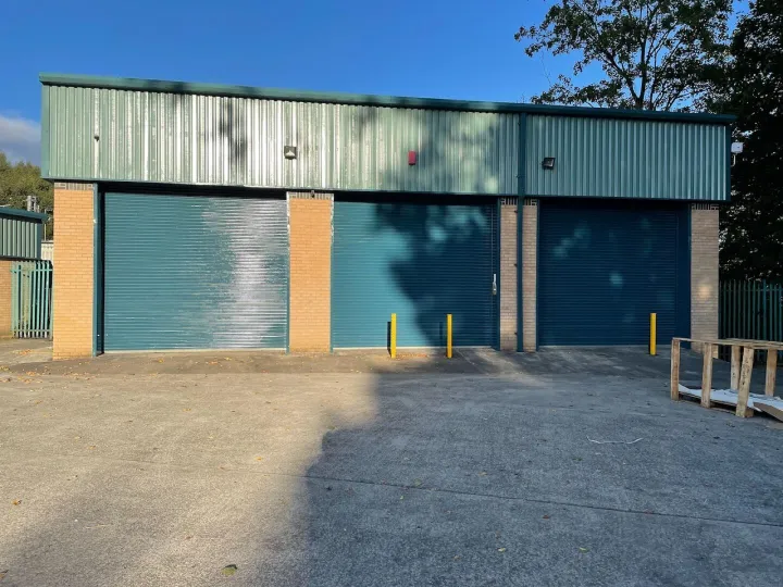 Industrial units with roller shutters and green roofs