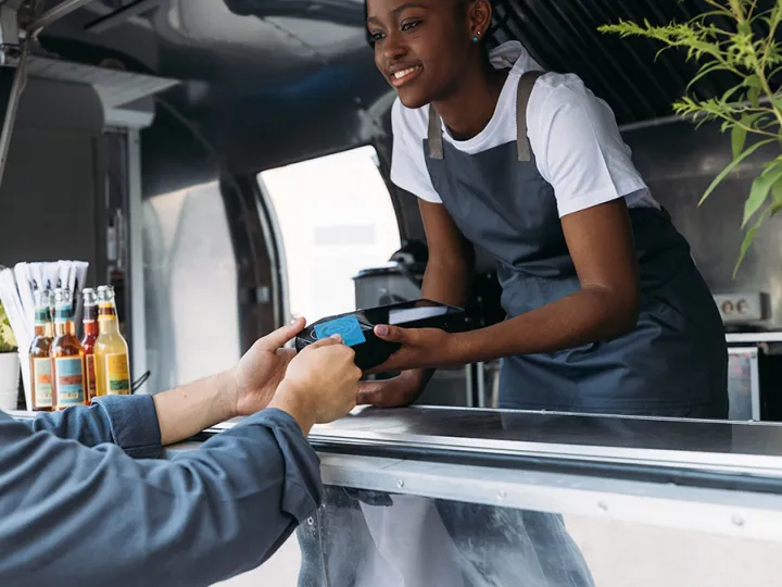 Digital payment tools like portable card readers empower MSMEs such as food truck vendors, making financial services more accessible than ever.