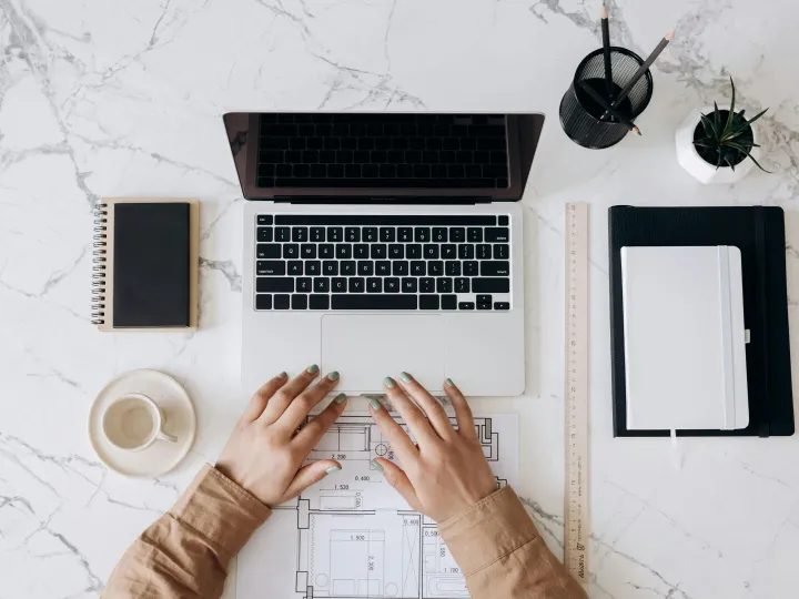Top view of a stylish home office desk with a lapt